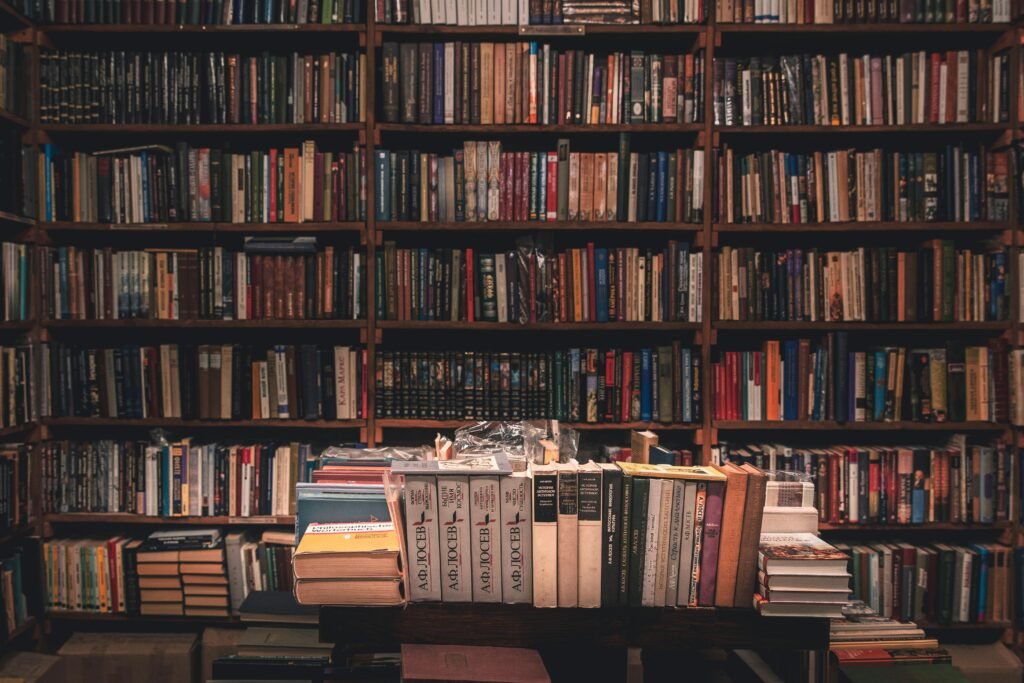 Bookshelf packed with books of all kinds, including those in different languages.