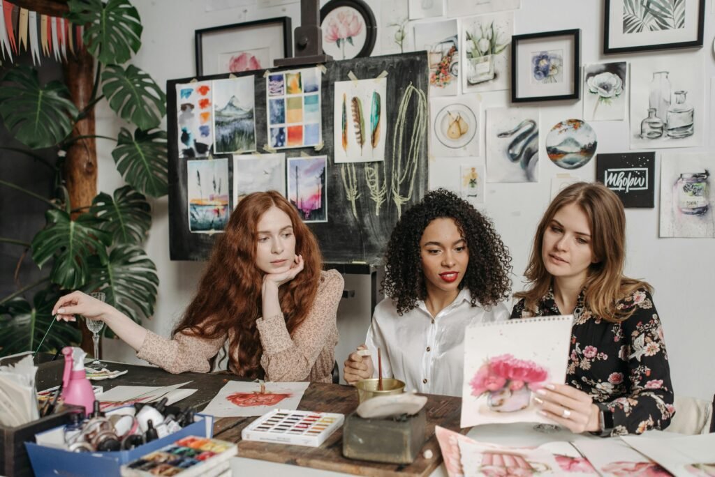 Three Friends participating in a creative art workshop.