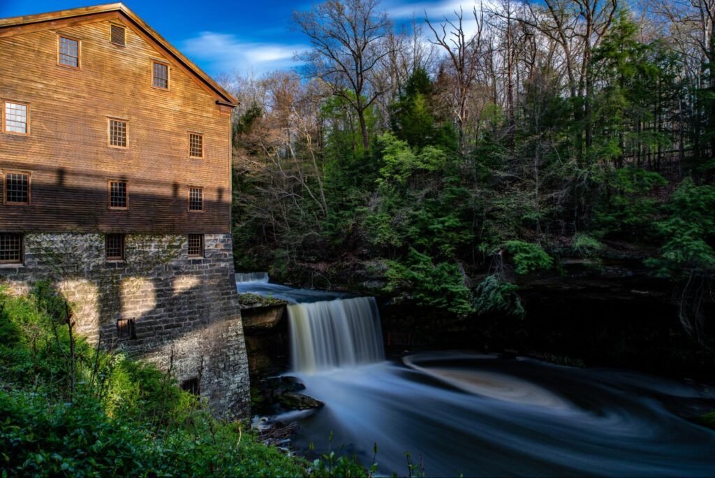 Historic Lanterman’s Mill beside a flowing waterfall is one of the best things to do in Youngstown OH this weekend.