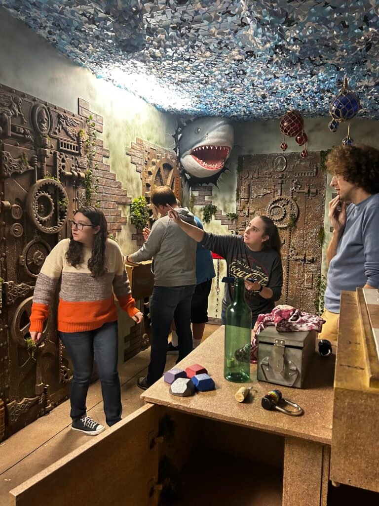 Group having fun in Mystery Mayhem's Atlantis-themed escape room.